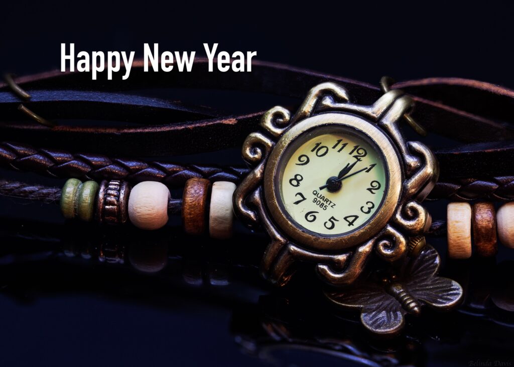 Happy New Year quote near a watch